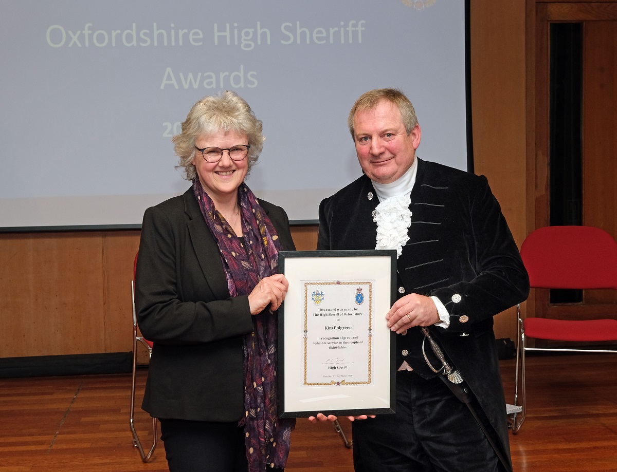 High sherrif and Kim Polgreen holding her certificate